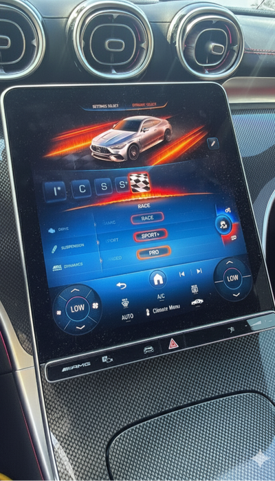 Car dashboard with a touchscreen display showing race mode